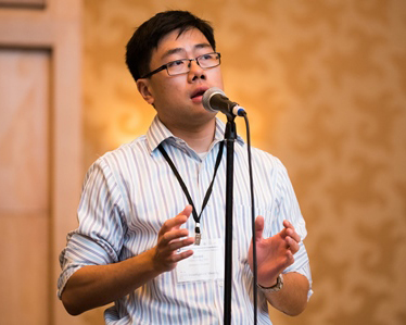 Dr. Zhang asks a question at the Investigators' Meeting.