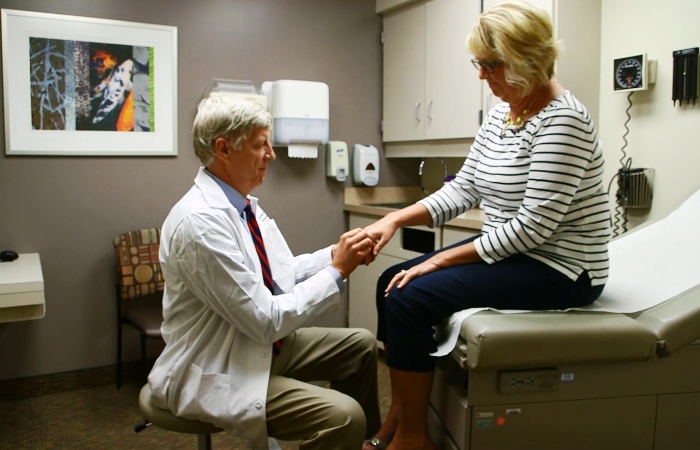 Rheumatologist Dr. James O'Dell with a patient who has rheumatoid arthritis.